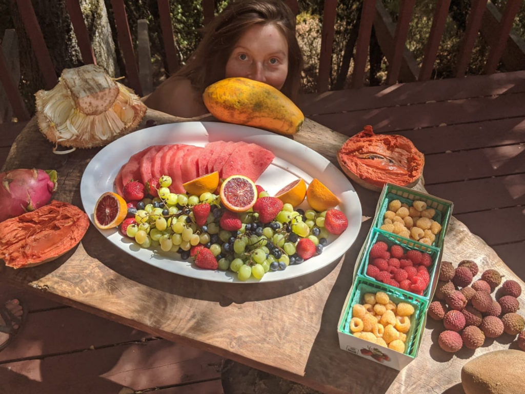 A person sits at the table with food.